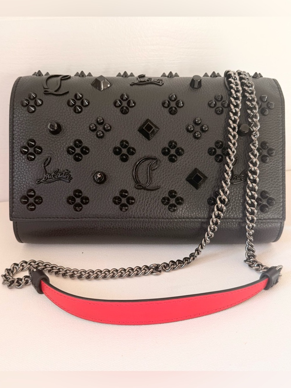 Christian Loubinthesky Paloma Clutch in Grained Calfskin with Gunmetal Hardware.